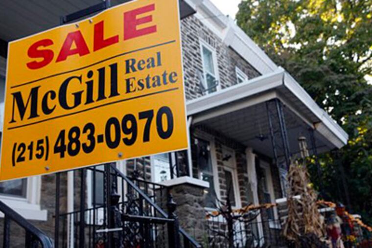 Home resales rose far more than expected last month to the highest level in more than two years as buyers scrambled to complete their purchases before a tax credit for first-time owners expires.(AP Photo/Matt Rourke)