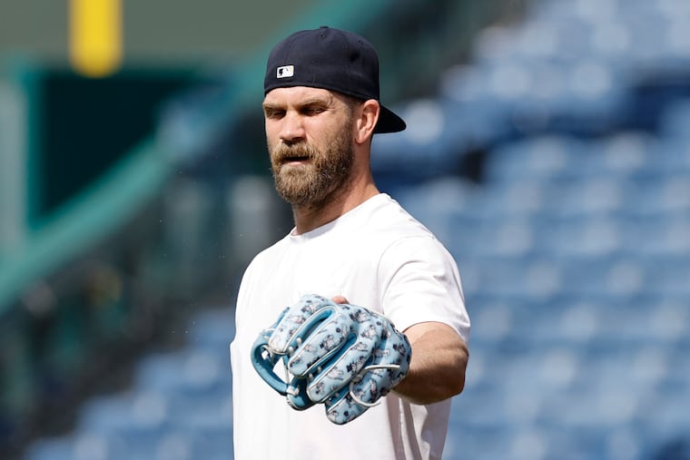 Injured Phillies first baseman Bryce Harper on the field befor a game against the Mets on June 20.