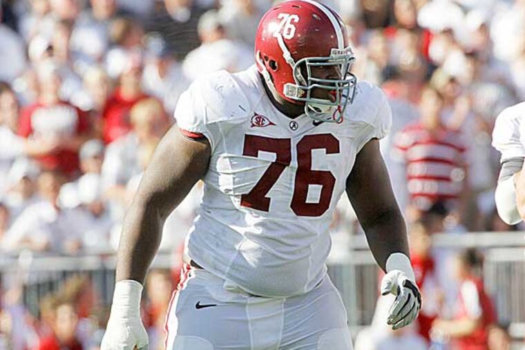 Alabama offensive tackle D.J. Fluker is at the Senior Bowl, and making history - since he recently graduated, he has been allowed to participate even though he was technically a junior last season. (Keith Srakocic/AP file photo)