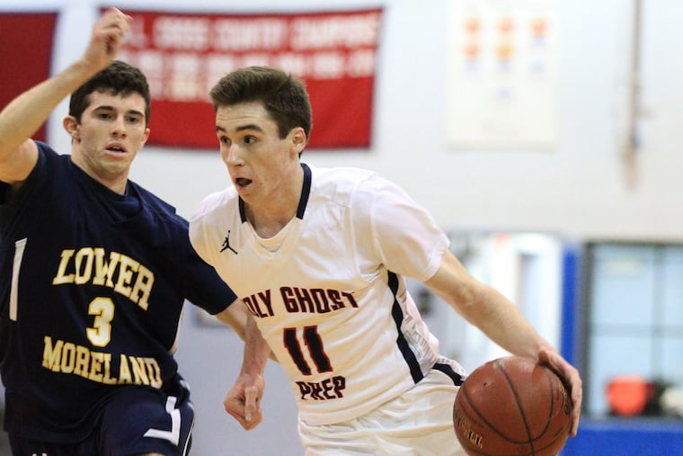 Holy Ghost Prep's Jack Elliott drives against Lower Moreland's Shane Cohen in a Bicentennial Athletic League game last season.
