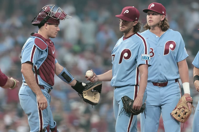 Aaron Nola (center) had his third consecutive solid start, a positive development for the back end of the rotation after he allowed three earned runs in six innings on Thursday.