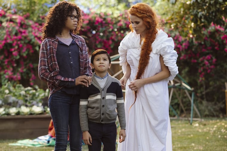 Storm Reid, (Meg) Deric McCabe (Charles Wallace) and Reese Witherspoon (Mrs. Whatsit) in a scene from A Wrinkle In Time.