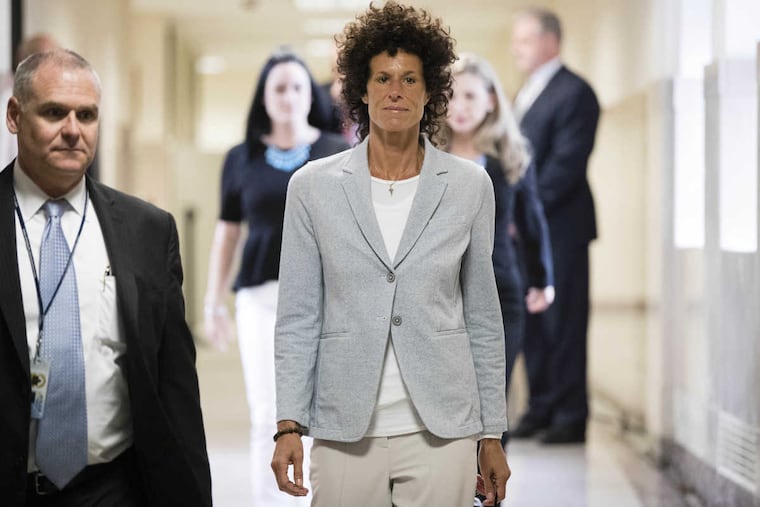 Andrea Constand walks to the courtroom during Bill Cosby's sexual-assault trial at the Montgomery County Courthouse in Norristown on Tuesday.