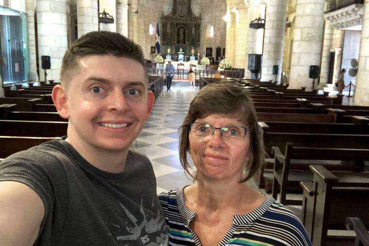 In this June 2018 selfie provided by Sherry Weddle, she poses for a photo with her son, journalist Cody Weddle, during a vacation in Santo Domingo, Dominican Republic. (Courtesy Sherry Weddle via AP)