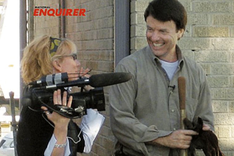 In this Dec. 27, 2006 photo, former U.S. Sen. John Edwards, D-NC, is shown with videographer Rielle Hunter in the 9th Ward of New Orleans, La. (AP Photo/The National Enquirer)