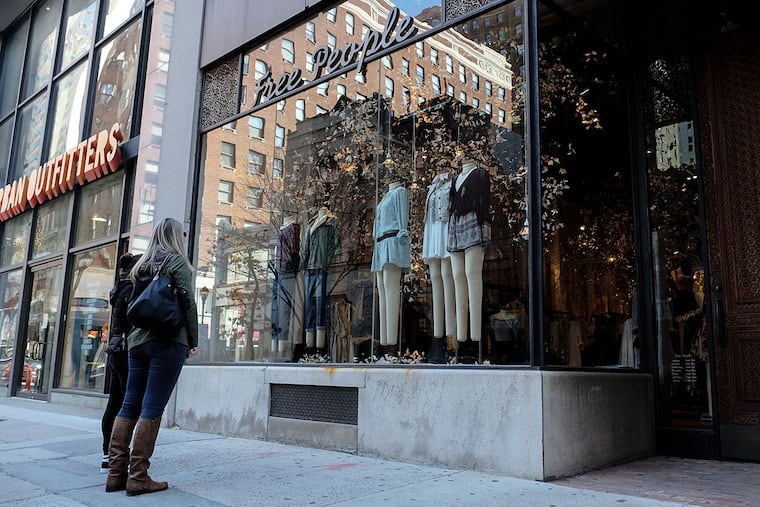 Courtney Fairfield, 24, looks over the Free People window display with friend Dana Daniels, 25.