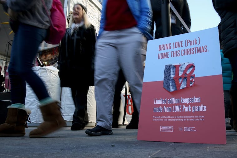 A sign advertises the chance to buy a granite Love Park keepsake at Love Park on Friday, Nov. 24, 2017.