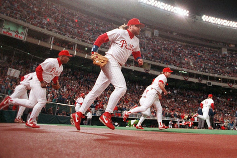 John Kruk and Lenny Dykstra lead the Phillies on to the field to resume Game 3 of the 1993 World Series after a 72-minute rain delay.