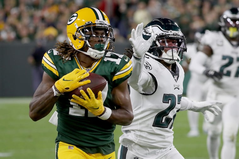 Packers wide receiver Davante Adams (left) beats Eagles cornerback Sidney Jones for a long catch last Thursday at Lambeau Field.