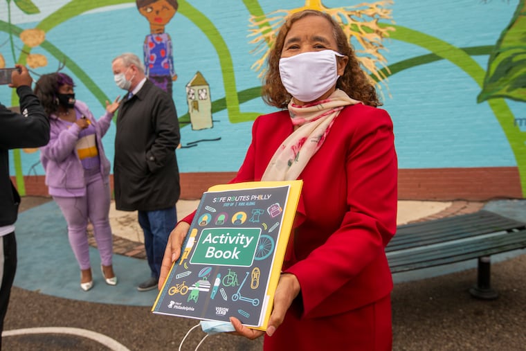 Deanda Logan, principal of William Cramp Elementary School, with the Safe Routes Philly Activity Book. Safe Routes Philly, the city's bicycle and pedestrian safety education program, was unveiled Monday at William Cramp Elementary in Fairhill.