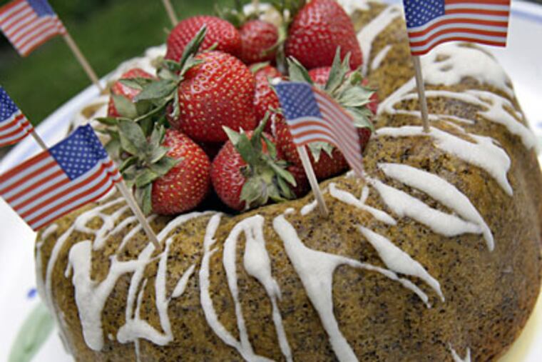 "In Flanders Field" Poppy Seed Cake With Lemon Glaze and Strawberries is especially fitting for a traditional memorial Day picnic.