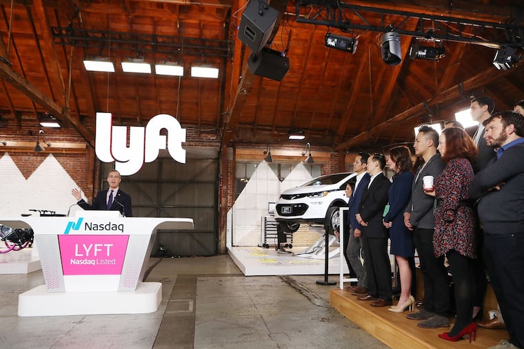 Los Angeles Mayor Eric Garcetti, left, speaks at the Nasdaq opening bell ceremony celebrating Lyft's initial public offering (IPO) on March 29, 2019 in Los Angeles, Calif. (Mario Tama/Getty Images/TNS)