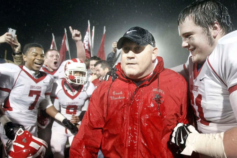 Delsea coach Sal Marchese is stoic after being doused by Bailey Lenney (61) and others. ELIZABETH ROBERTSON / Staff Photographer
