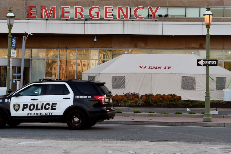 A New Jersey Emergency Management System Task Force tent is set up outside the emergency room at the AtlantiCare Regional Medical Center in Atlantic City in March. Under a deal announced Tuesday, AtlantiCare will no longer be part of Geisinger, a Pennsylvania health system.