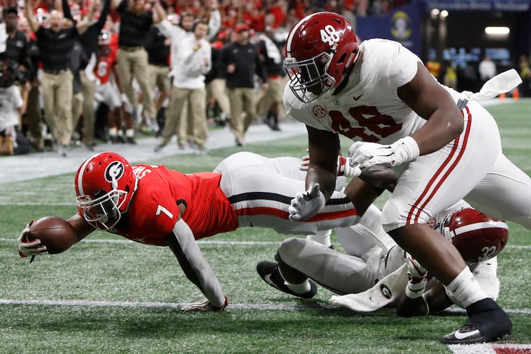 Georgia running back D'Andre Swift (7), who played at St. Joe's Prep High School, is 25-1 to win the Heisman. His Bulldogs open the season ranked No. 3 in the AP poll.