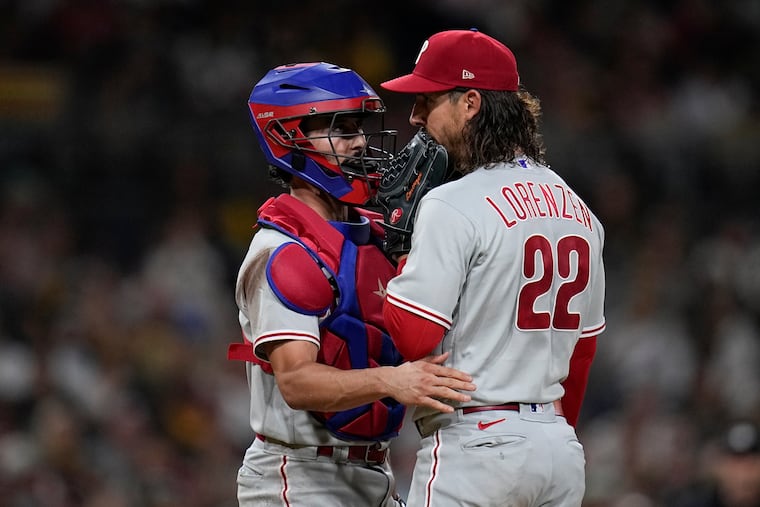 Michael Lorenzen talks with catcher Garrett Stubbs during a mound visit in the sixth inning on Tuesday.