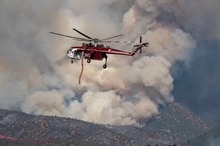 A Sikorsky Skycrane maneuvers into position to refill during efforts to fight the Widemouth 2 Fire east of Fillmore, Utah, on Tuesday, Aug. 4, 2026, before it crashed on Friday, Aug. 7.