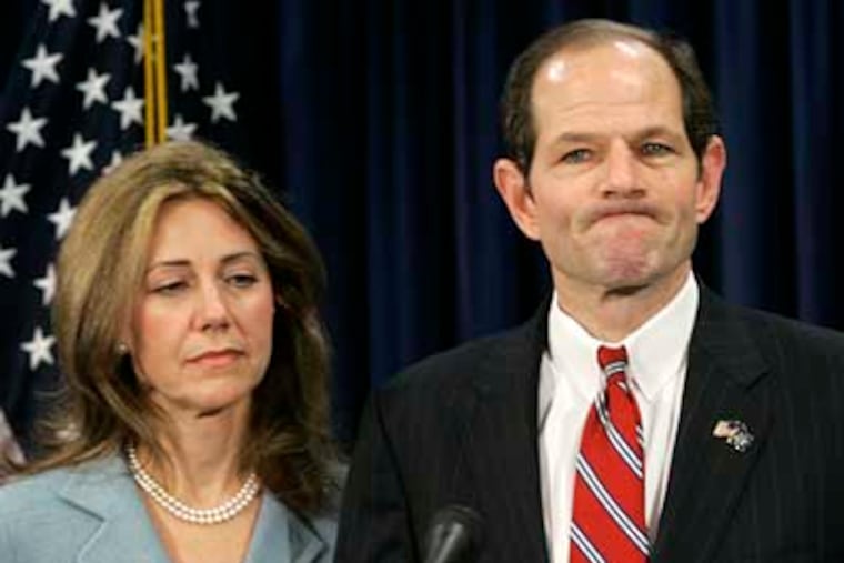 Gov. Eliot Spitzer, with his wife, Silda, in 2008, addresses the media and apologizes to his family for a "private matter." (AP Photo/Mary Altaffer, file)