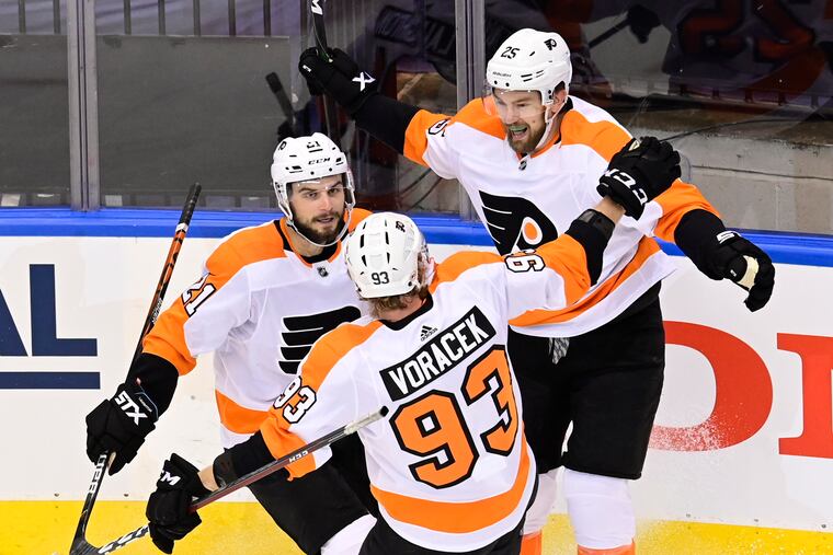 Flyers left winger James van Riemsdyk (25) celebrates his goal against the New York Islanders with Scott Laughton (21) and Jake Voracek (93) during first-period of Game 6. Will all thre be back next season?