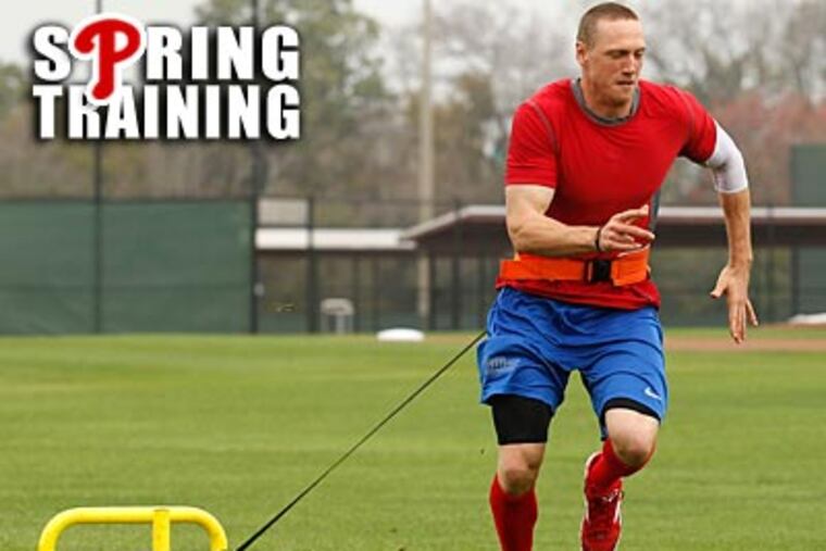 Phillies right fielder Hunter Pence runs while pulling a weight at Bright House Field on Saturday. (Yong Kim/Staff Photographer)