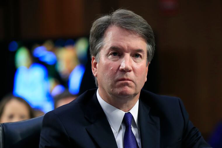 In this Sept. 4, 2018 photo, Supreme Court nominee Brett Kavanaugh, listens to Sen. Cory Booker, D-N.J. speak during a Senate Judiciary Committee nominations hearing on Capitol Hill in Washington.