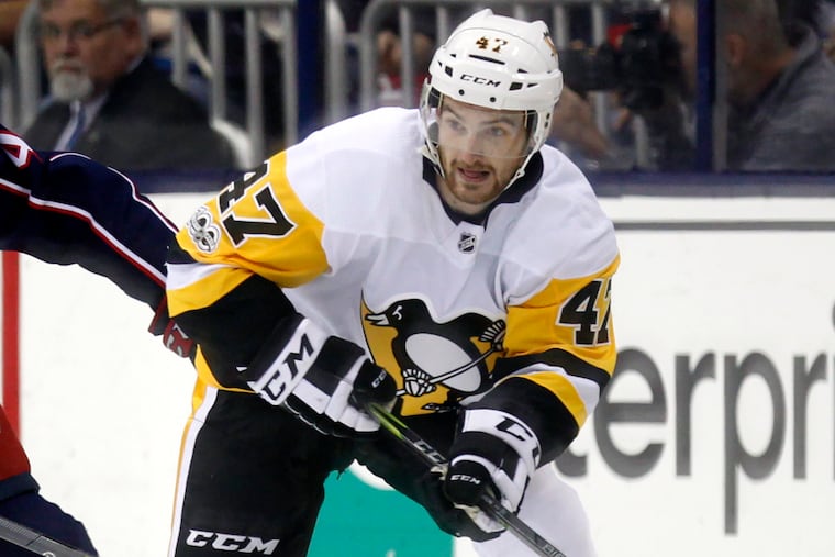 FILE - Pittsburgh Penguins forward Adam Johnson in action during an NHL hockey game in Columbus, Ohio, in 2017. American hockey player Adam Johnson has died after a “freak accident” during a game in England on Saturday, Oct. 28, 2023 his club said. The 29-year-old Minnesota native was playing for the Nottingham Panthers in a Challenge Cup game against the Sheffield Steelers when he suffered a slashed neck during the second period of the game at Sheffield’s Utilita Arena.