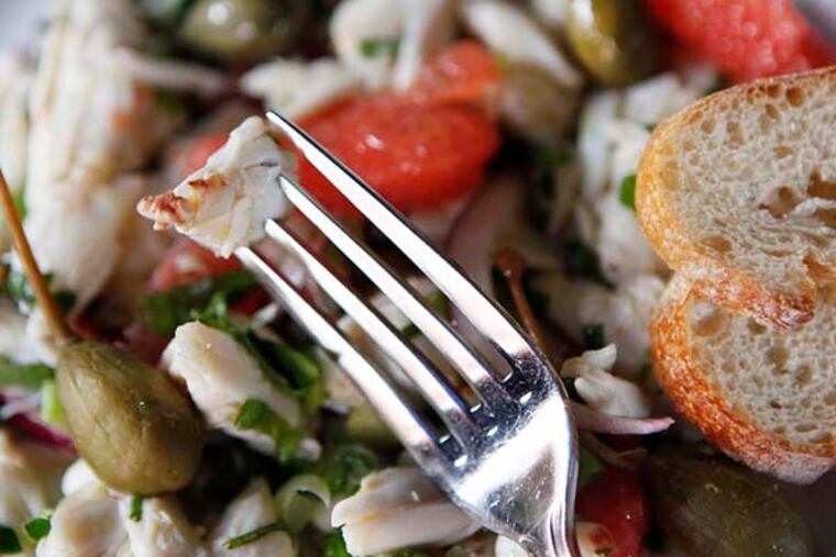 Crab meat salad with pink grapefruit and caper berries created by chef owner Konstantinos Pitsillides of Kanella, 1001 Spruce St. ( MICHAEL S. WIRTZ / Staff Photographer )