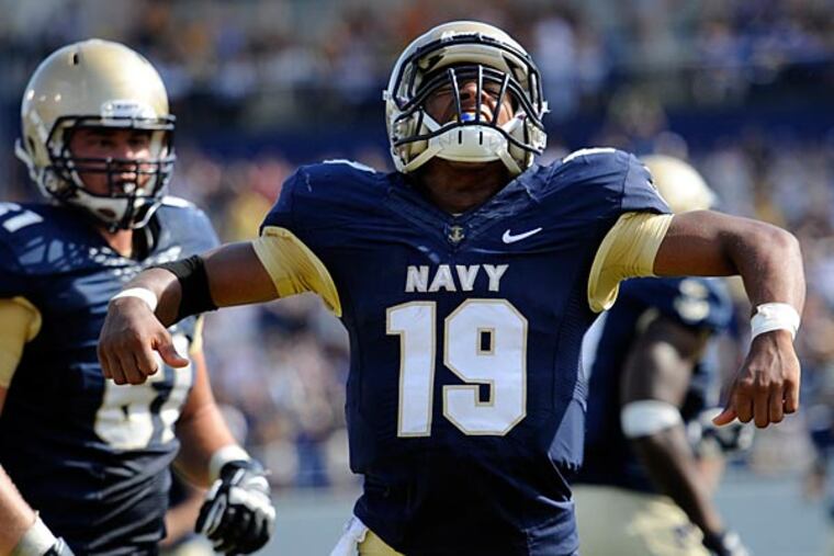 In this Oct. 5, 2013 file photo, Navy quarterback Keenan
Reynolds celebrates after scoring a touchdown. (Nick Wass/AP)