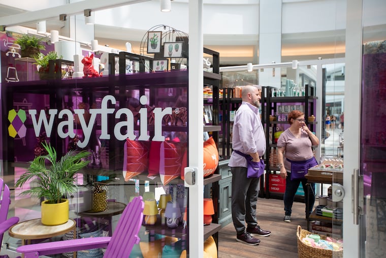 Brian Kuznesoff, store manager of Wayfair, stands with retail associate, Dawn Hagopian, in the store at the King of Prussia Mall, Monday, August 5, 2019. Pop ups such as Wayfair and Dormify are coming from online to life at the mall.