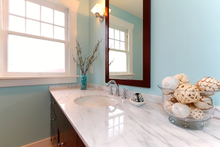 There are no rules that all the bathrooms in your home match each other.