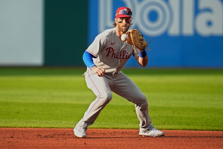 Phillies first baseman Bryce Harper fields a ground ball against the Guardians on Friday in Cleveland.