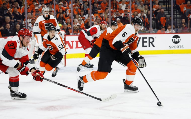 Flyers defenseman Travis Sanheim skates with the puck past Carolina Hurricanes right wing Andrei Svechnikov in Game 3 of the Eastern Conference second round Stanley Cup playoffs on Thursday, May 7, 2026, in Philadelphia.