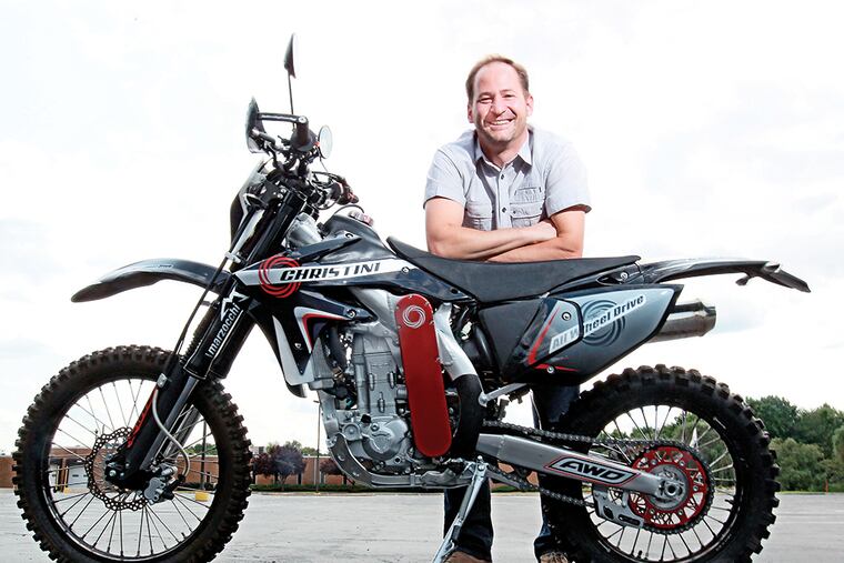 Steve Christini with his Christini All Wheel Drive 450 Military edition motorcycle, which he assembles in Cherry Hill, NJ. Christini and his Philadelphia-based Christini Technologies Inc. enters the fray on the illegal immigrant front. Its all-wheel-drive motorcycles will be put into border-patrol service in Texas. ( MICHAEL BRYANT / Staff Photographer )