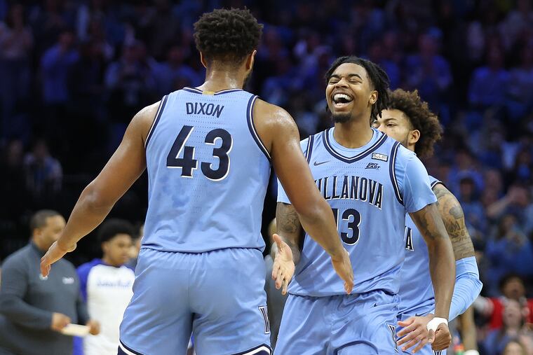 Villanova's Hakim Hart (right) celebrates with Eric Dixon during the convincing win against Seton Hall at the Wells Fargo Center.