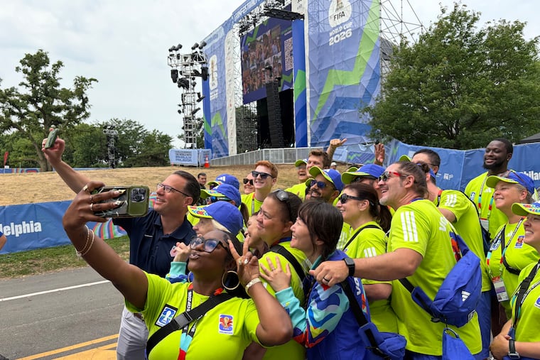 Pennsylvania Gov. Josh Shapiro poses with volunteers at FIFA Fan Fest at Fairmount Park in Philadelphia Monday.