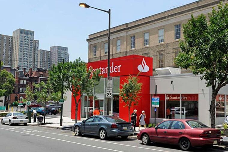 Many expected a multistory development on this lot at 38th and Chestnut Streets, in keeping with neighboring buildings, but Santander's money carried the day. (TOM GRALISH / Staff Photographer)