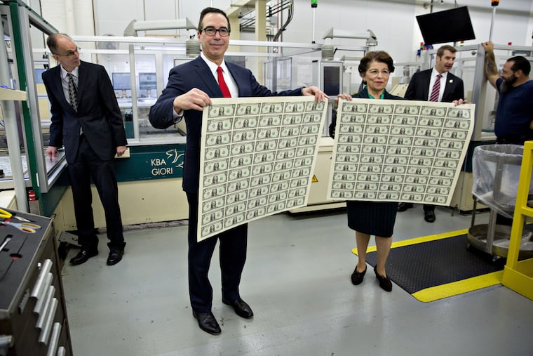 Treasury Secretary Steven Mnuchin and Small Business Administration head Jovita Carranza at the U.S. Bureau of Engraving and Printing in 2017. The new stimulus bill now forgives up to eight months of principal and interest payments on Section 7(a) and 504 Microloans from the SBA.