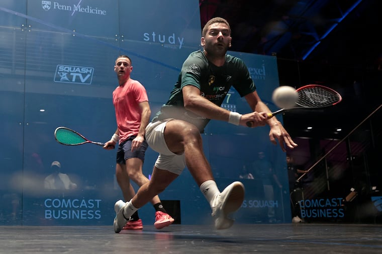 Baptiste Masotti (left) watches Aly Abou El Einen return the ball during the 2025 Comcast Business U.S. Open Squash Championships at the Arlen Specter US Squash Center in Philadelphia on Tuesday.