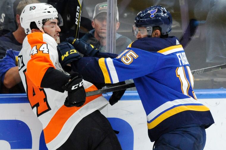 St. Louis Blues' Robby Fabbri (15) checks Philadelphia Flyers' Phil Varone (44) during the third period of an NHL hockey game Thursday, April 4, 2019, in St. Louis. (AP Photo/Bill Boyce)