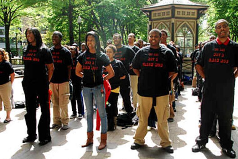Wearing "We are not a flash mob" T-shirts , students from the Campaign for Nonviolent Schools gather in Rittenhouse Square. They pledged to reject violence and injustice. (Sarah Schu / Staff)
