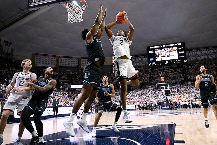 UConn guard Tristen Newton shoots as Villanova guard TJ Bamba defends during the second half Saturday night.