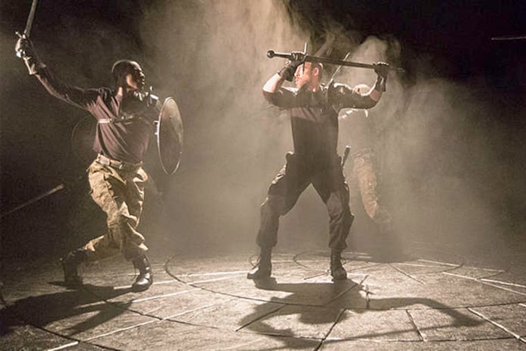 Ian Merrill Peakes as Macbeth (center) battles Jahzeer Terrell (left), Terence MacSweeny, and Sean Bradley in Arden Theatre Company's production of "Macbeth." (Mark Garvin)