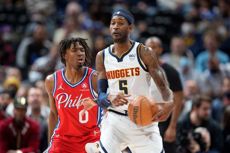 The Nuggets' Will Barton is guarded by the Sixers' Tyrese Maxey in the first half. Maxey scored a team-high 22 points in the victory.