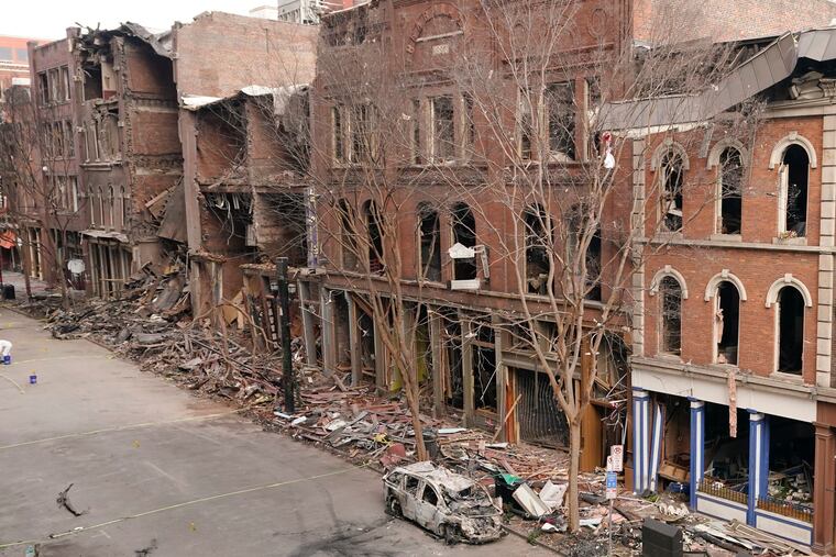 A vehicle destroyed in a Christmas Day explosion remains on the street on Tuesday in Nashville, Tenn.