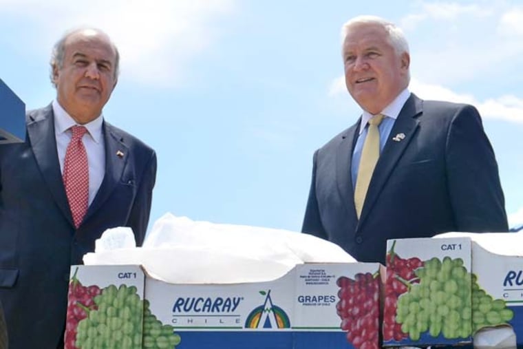 Gov. Corbett (right) and Chilean Minister of Agriculture Luis Mayol Bouchon (left) mark what they hope will be an expanding Chilean and South American fruit trade to Philadelphia, at dockside press conference May 14, 2013 at the Packer Avenue Marine Terminal in South Philadelphia. Forty percent of all Chilean agricultural exports to the United States arrive at ports on the Delaware River. ( TOM GRALISH / Staff Photographer )