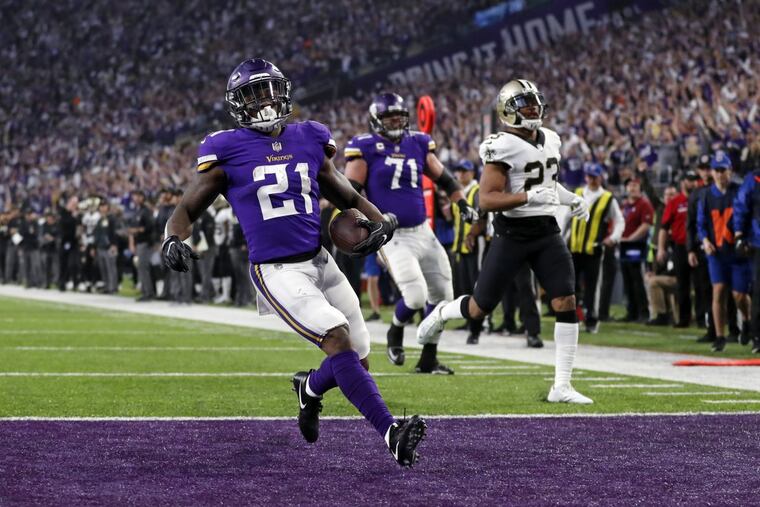 Minnesota Vikings running back Jerick McKinnon (21) runs in for a touchdown against the New Orleans Saints during the first half of an NFL divisional football playoff game in Minneapolis, Sunday, Jan. 14, 2018.
