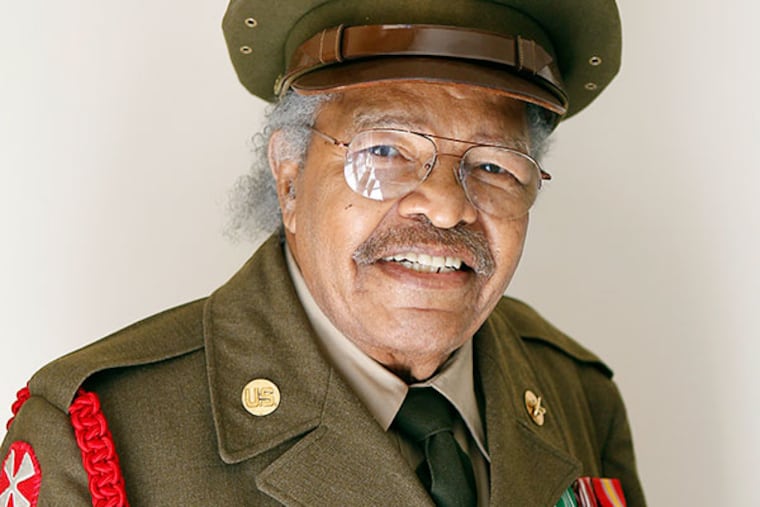 Clarence Davis is wearing old military uniform, and posing for photo at his Cherry Hill condo. ( AKIRA SUWA / Staff Photographer )