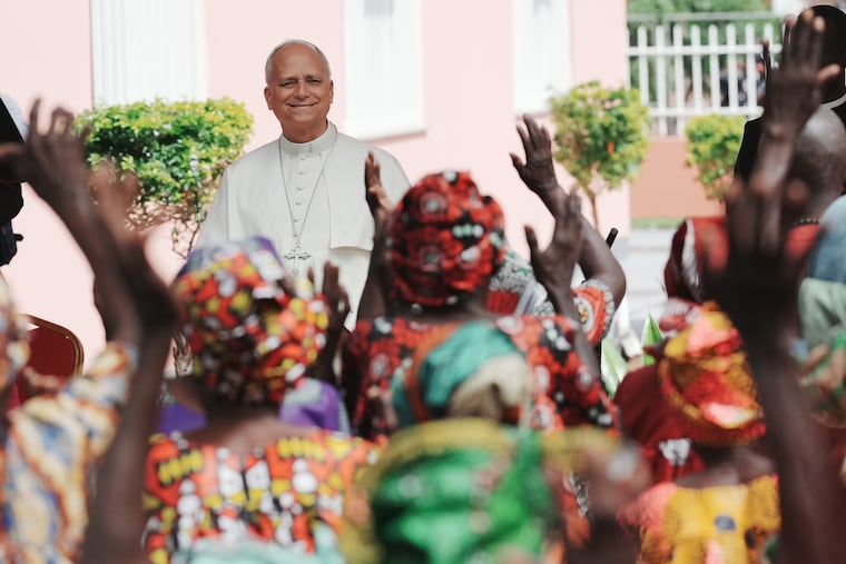 Pope Leo XIV is cheered by faithful as he visits a nursing home Monday in Saurimo, Angola.