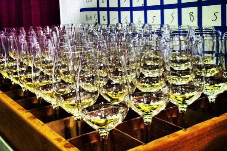 A flight of $20-$25 chardonnays is delivered to judges at the San Francisco Chronicle competition; a Camden County chard took a gold.