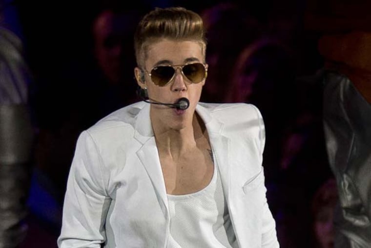 Canadian singer Justin Bieber performs at the o2 Arena in east London, Monday, March 4, 2013. (Photo by Joel Ryan/Invision/AP)
